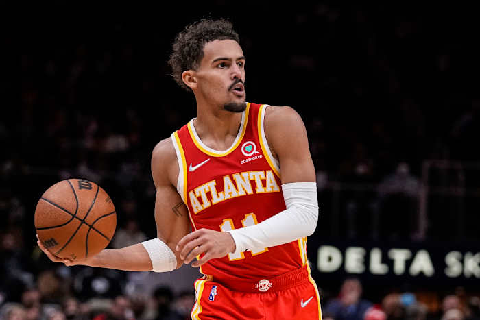 Atlanta Hawks guard Trae Young (11) handles the ball against the Charlotte Hornets during the second half at State Farm Arena.